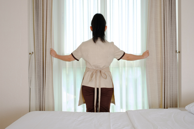 Professional Spa Staff Preparing Private Room for Client Arrival